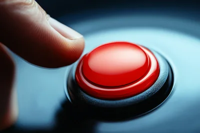 Finger About To Press A Large Red Button