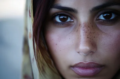 Close Up Portrait Of A Young Woman With Freckles