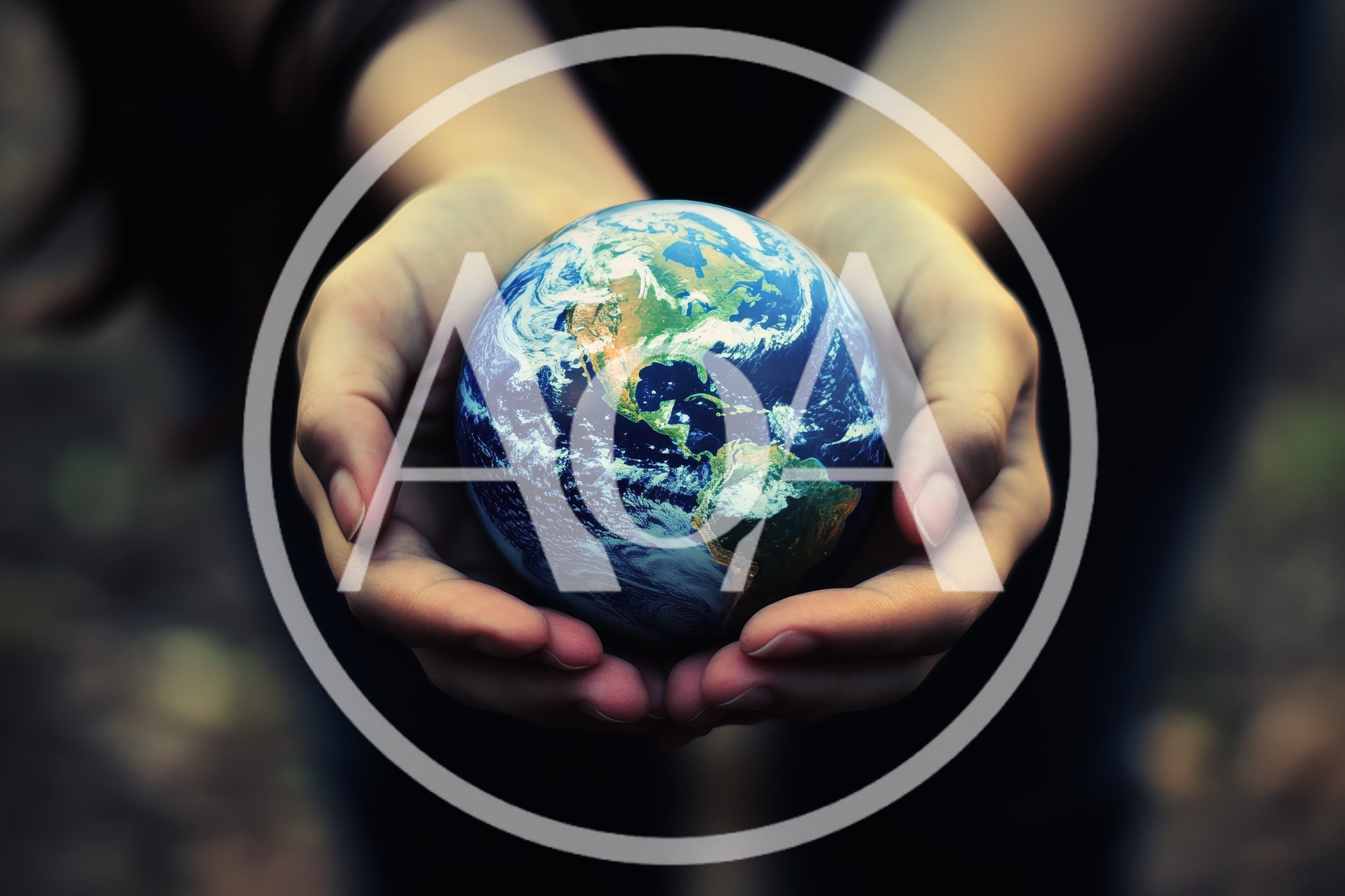 Hands Cupping A Glowing Earth Globe