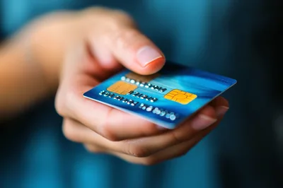 Close Up Of A Person Holding A Credit Card