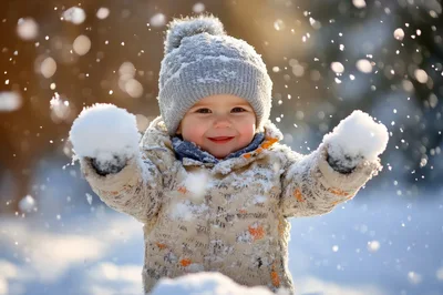 Happy Toddler Playing With Snow Outdoors