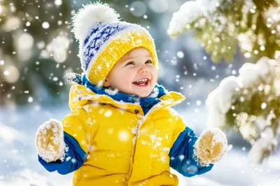Happy Toddler Playing In Snowy Winter Forest