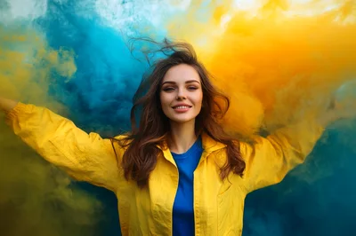 Young Woman Posing With Vibrant Blue And Yellow Smoke