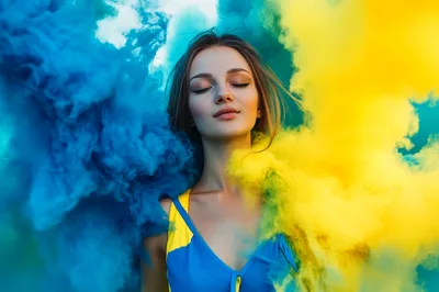 Young Woman Surrounded By Blue And Yellow Smoke