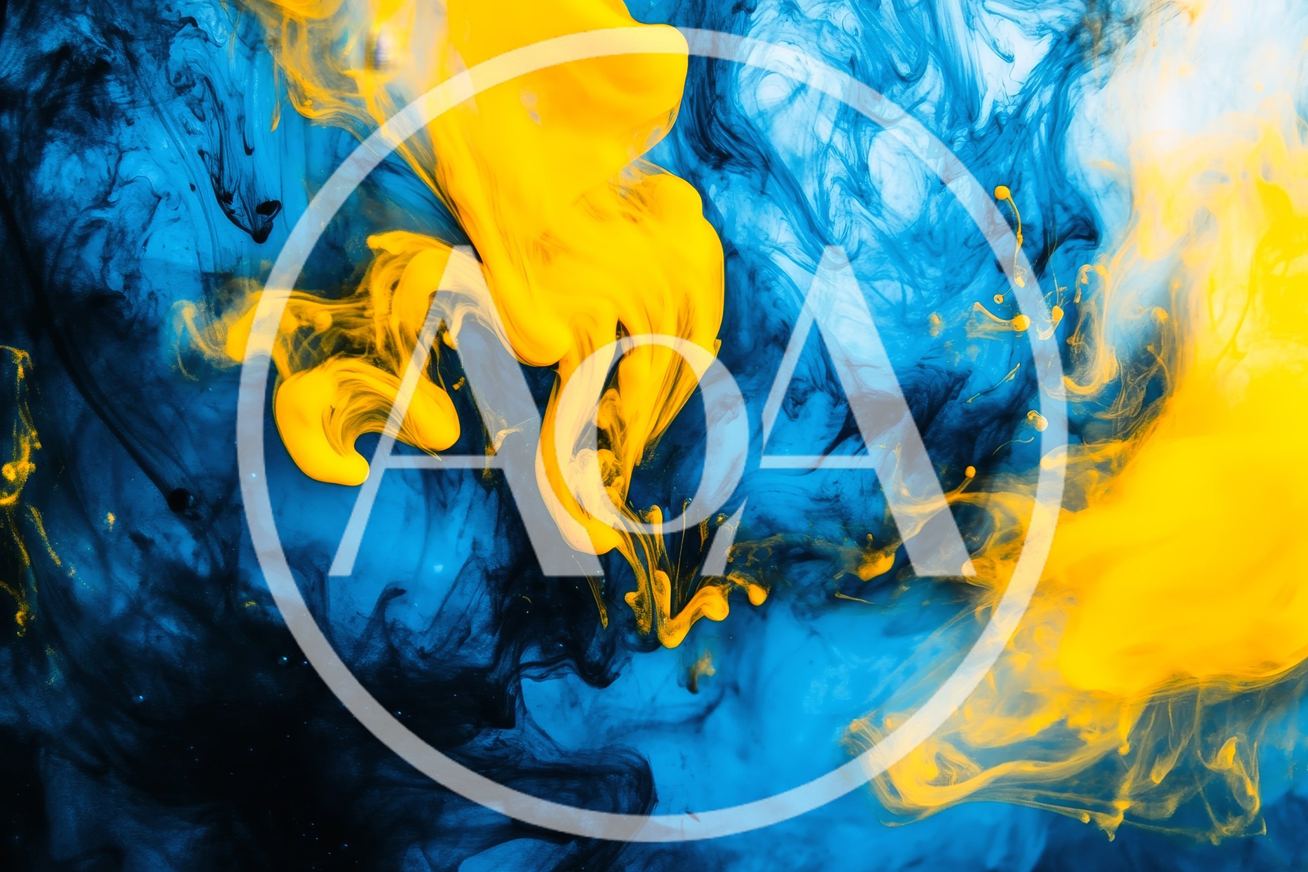 Yellow Ink Swirling In Blue Liquid