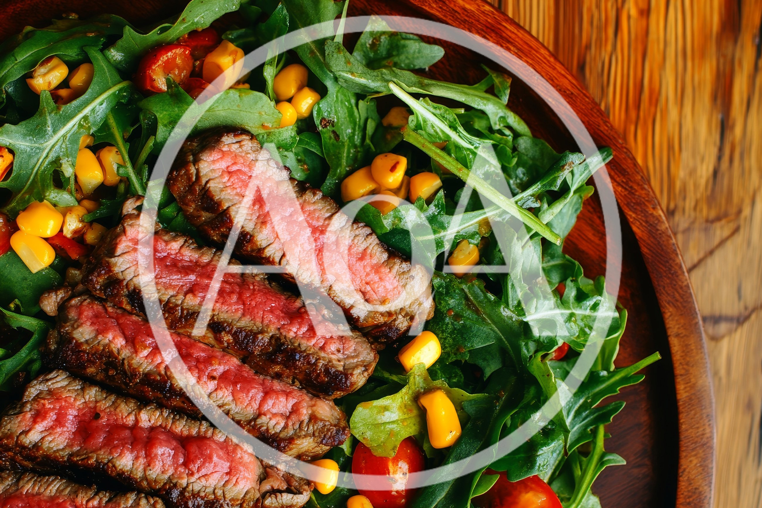 Grilled Steak Slices Served Over Fresh Arugula Salad