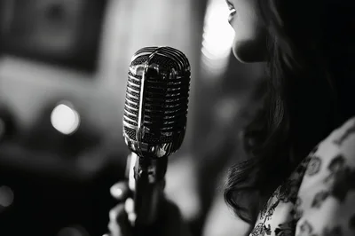 Close Up Of A Singer Using A Vintage Microphone