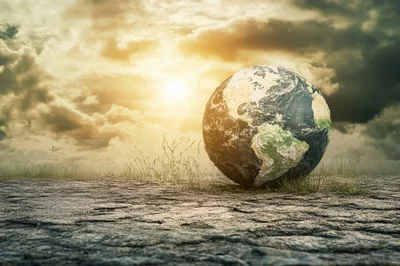Earth Globe Resting On Cracked Dry Earth