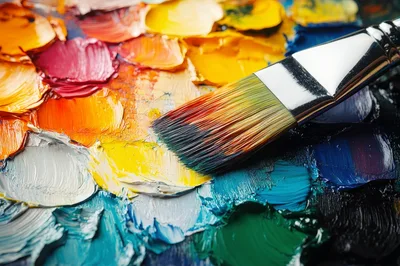 Artist Paintbrush Resting On A Colorful Oil Paint Palette