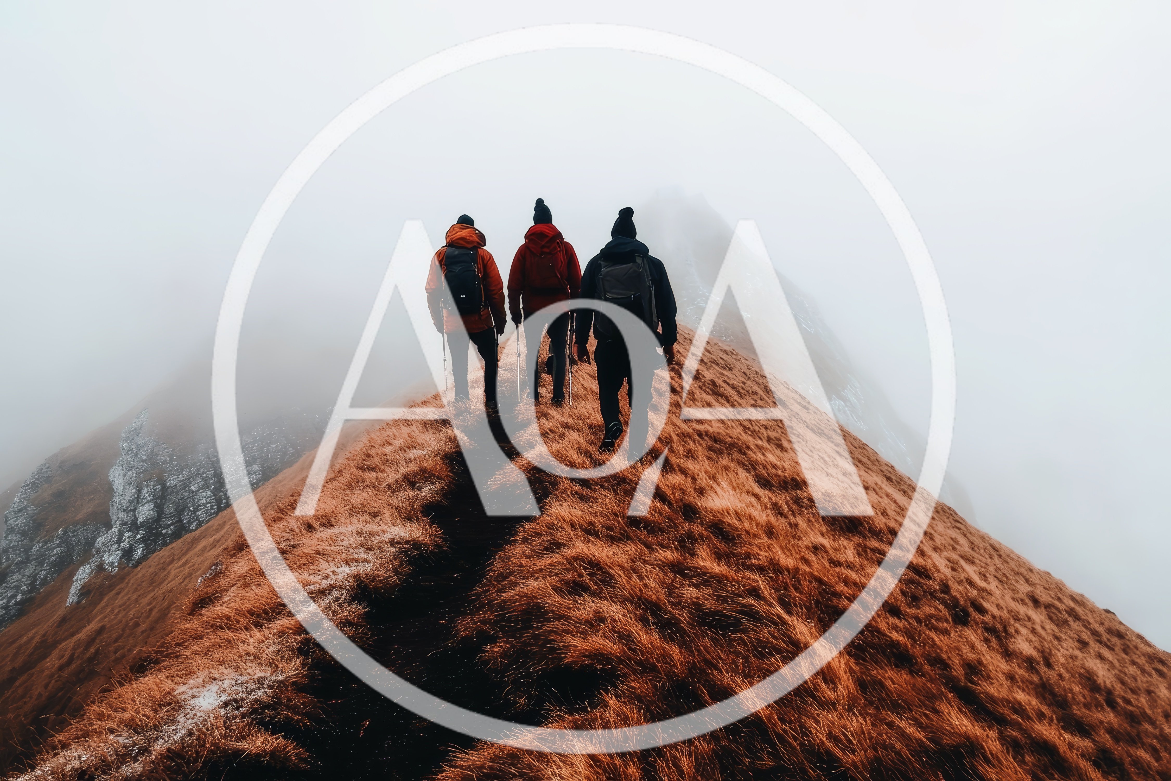 Three Hikers Trekking Along A Misty Mountain Ridge
