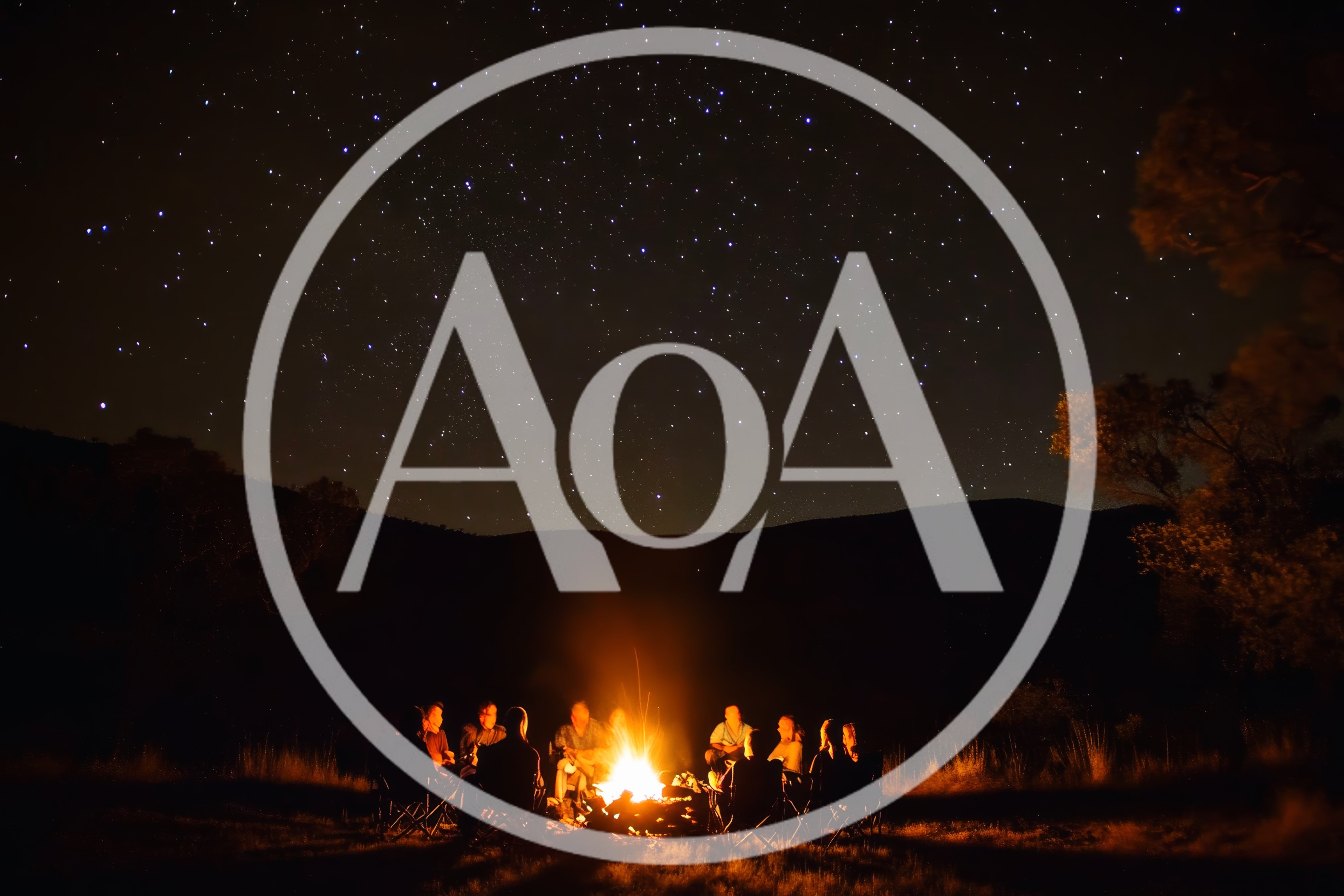 Group Of Friends Sitting Around A Campfire Under Starry Sky
