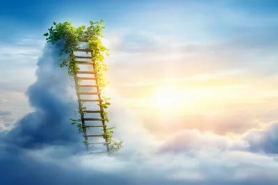 Wooden Ladder Leading Into Clouds At Sunset