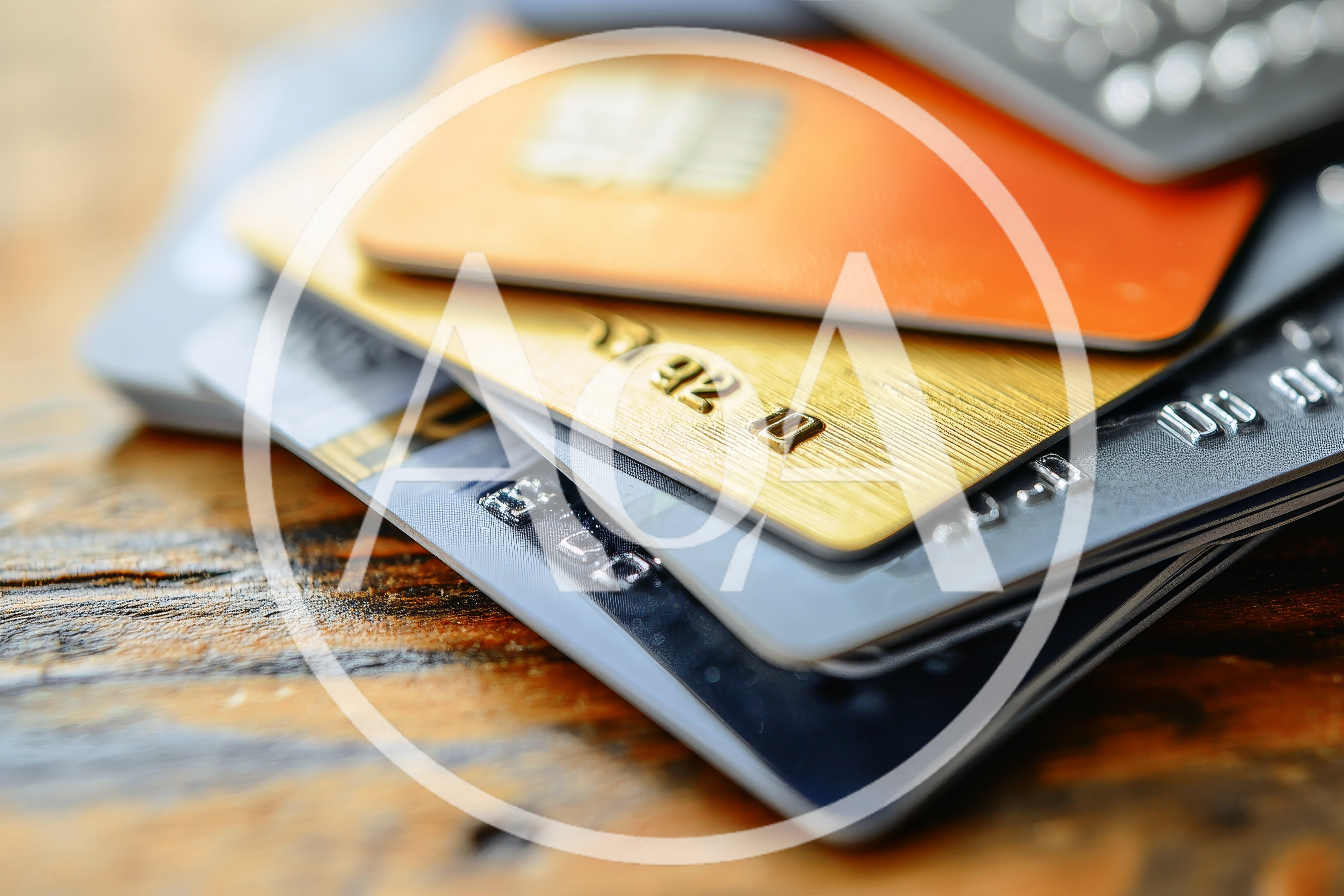 Stack of Various Credit Cards on Wooden Table