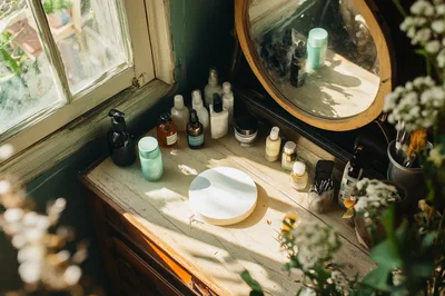 Skincare Products Arranged On A Vintage Wooden Vanity