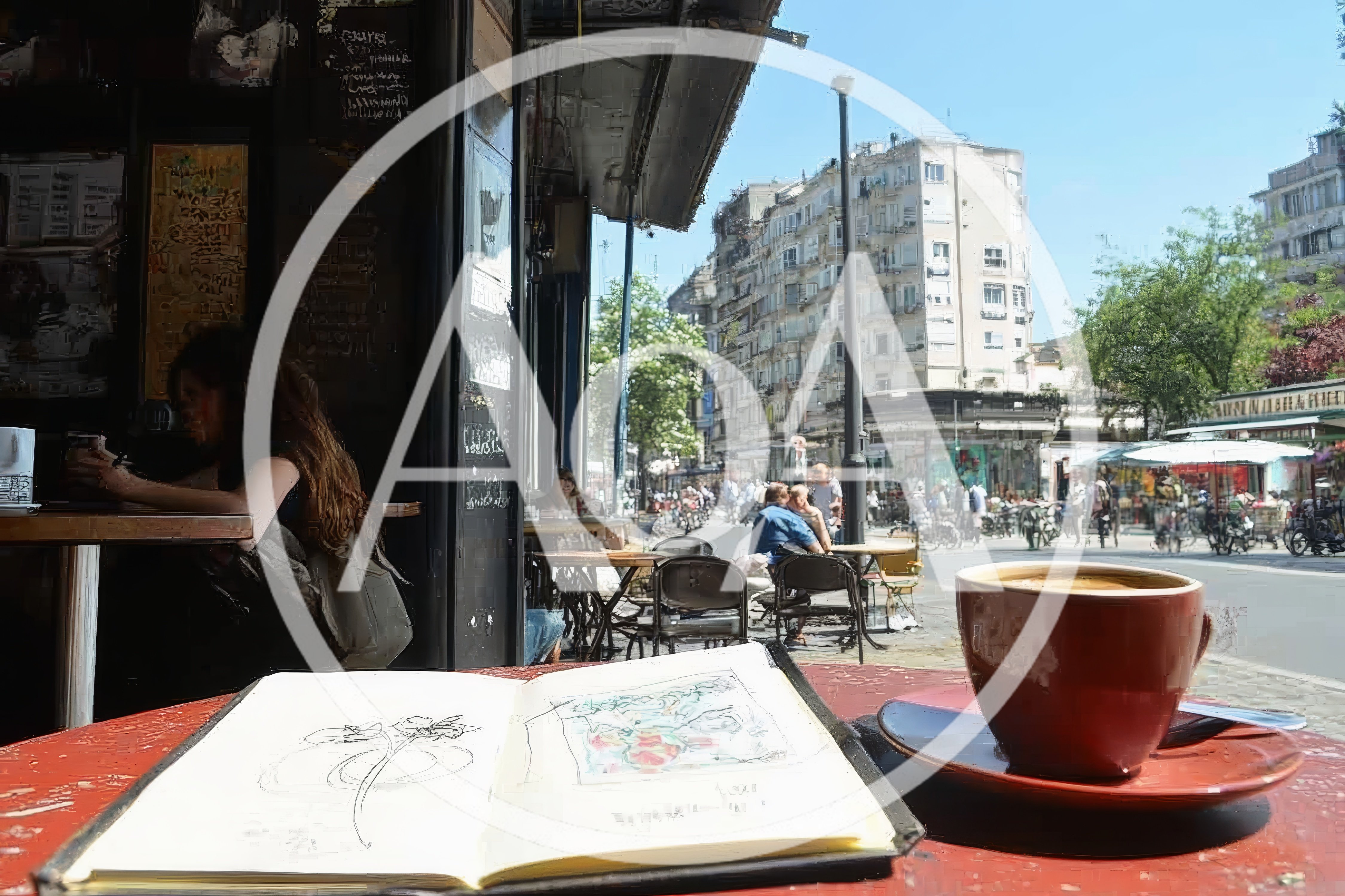 Sketchbook And Coffee Cup On A Cafe Table