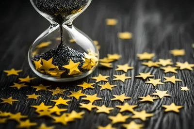 Hourglass With Black Sand And Gold Star Confetti