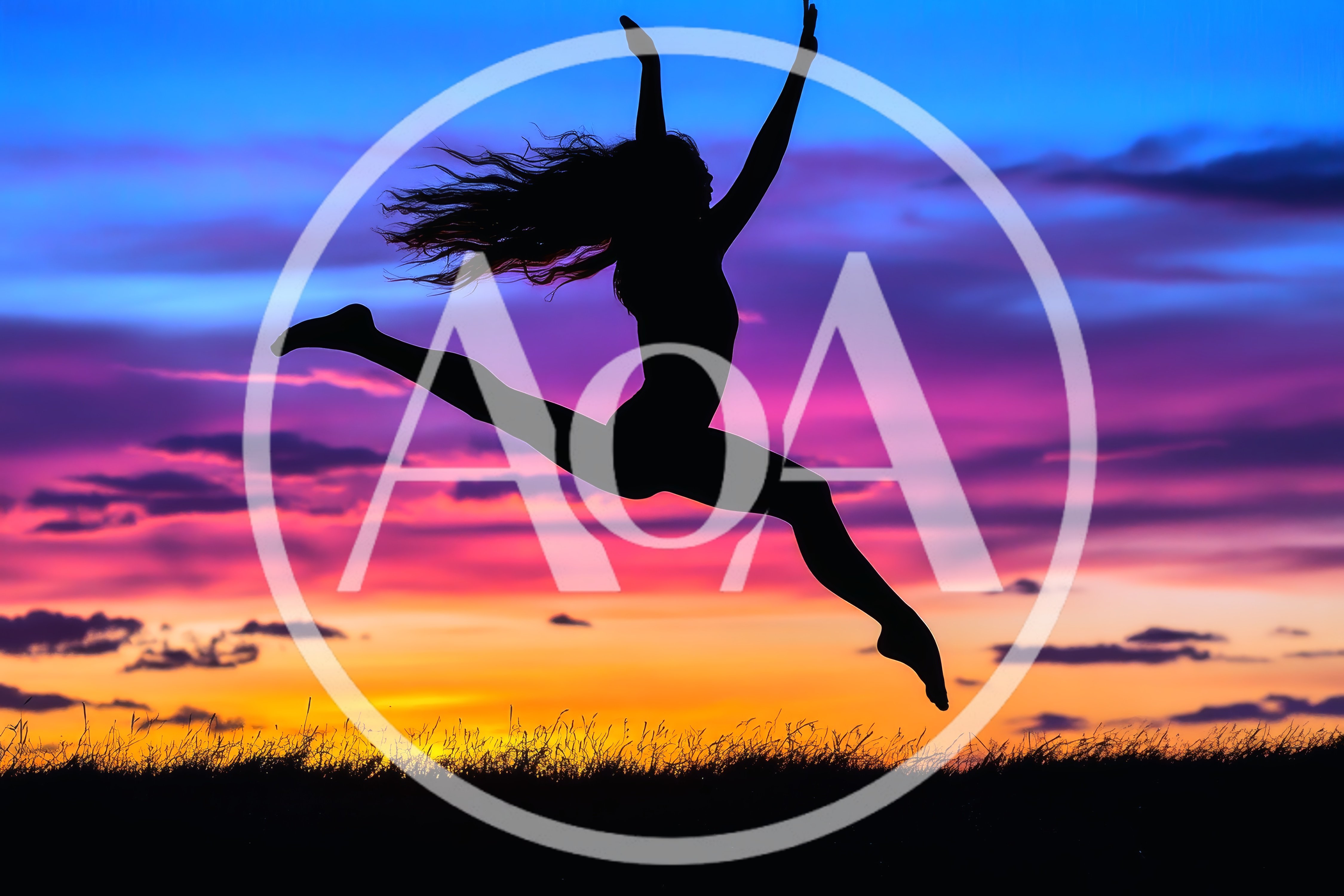 Silhouette Of A Woman Jumping Against A Sunset Sky