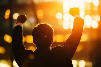 Successful Businessman Celebrating Victory With Raised Fists