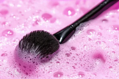 Makeup Brush Cleaning In Pink Soap Suds