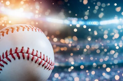 Baseball Resting In A Blurred Stadium Setting