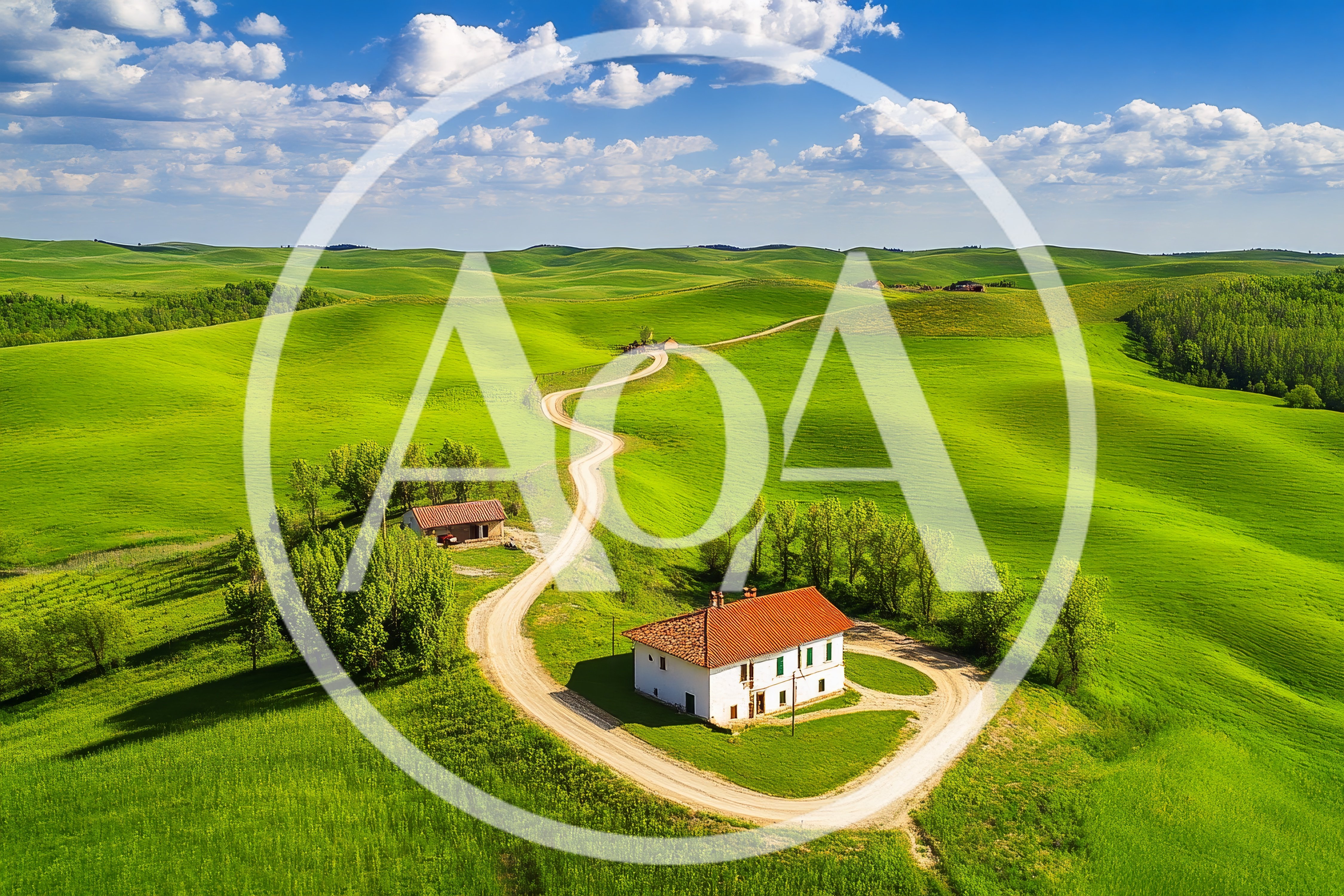 Aerial View of a Tuscan Farmhouse and Winding Road