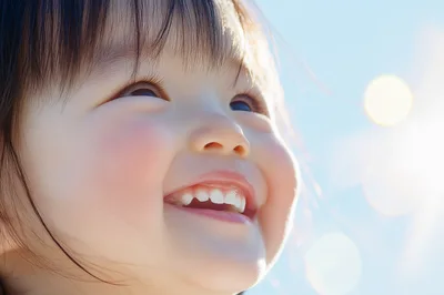 Close Up Portrait Of A Smiling Toddler Girl