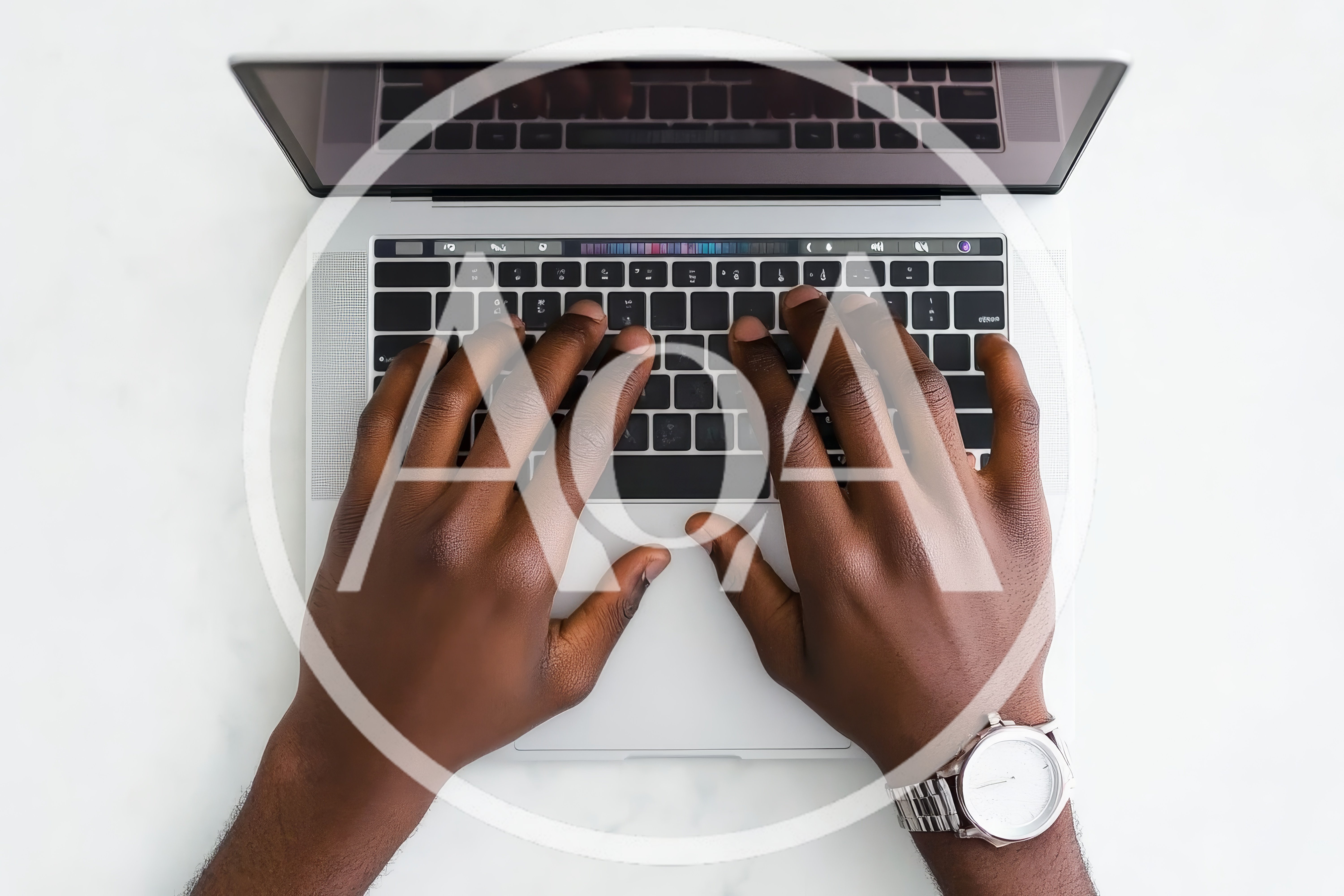 Top Down View Of Person Typing On Laptop