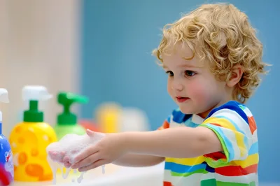 Toddler Boy Washing Hands With Soap Bubbles