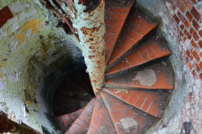 Old Abandoned Spiral Staircase in Brick Tower