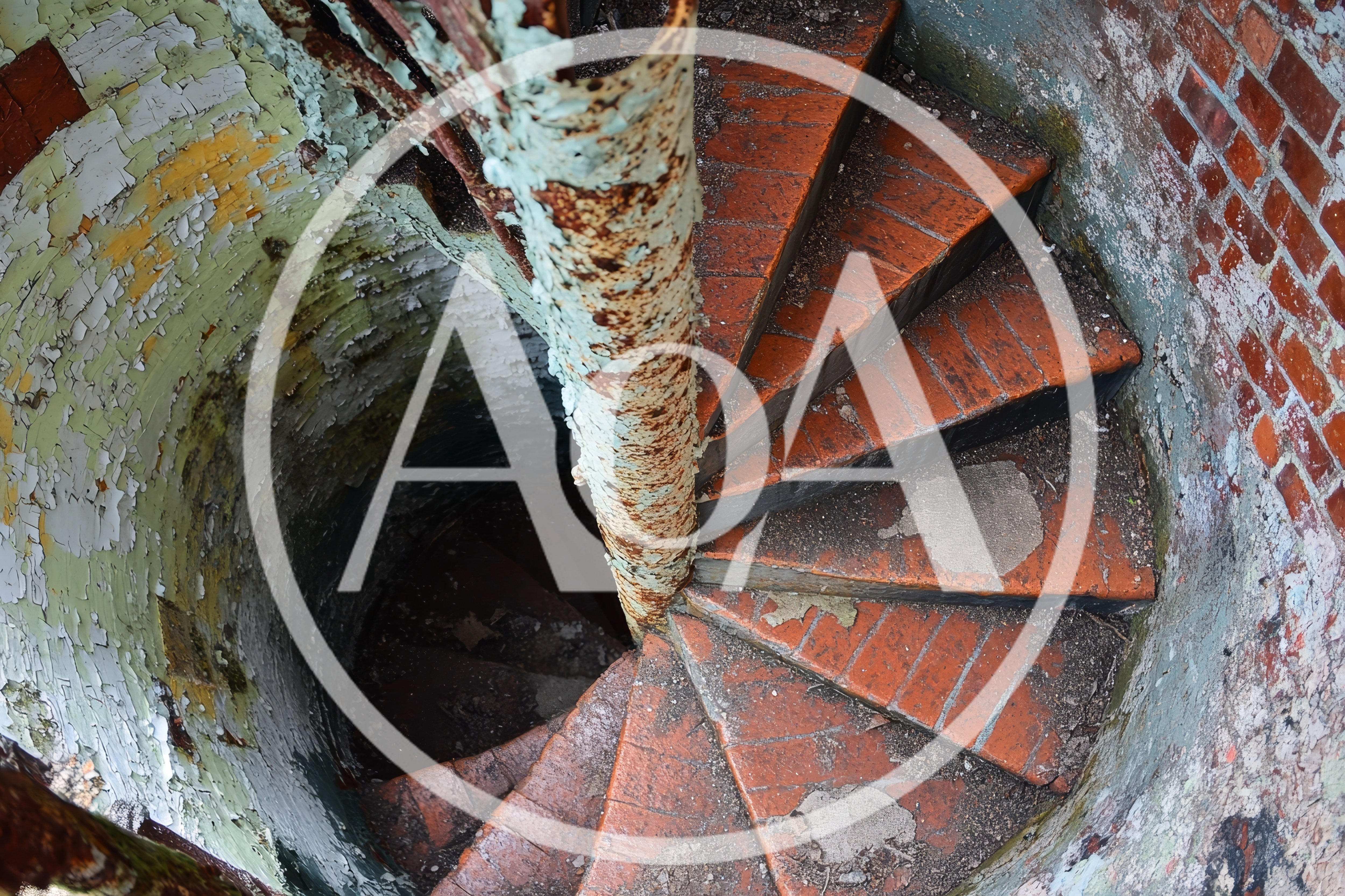Old Abandoned Spiral Staircase in Brick Tower