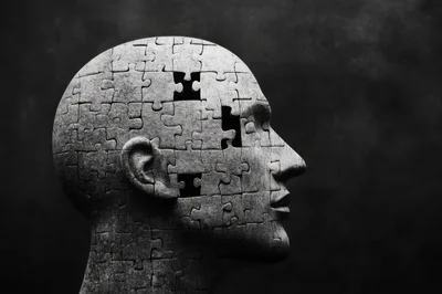 Human Head Sculpture Made Of Jigsaw Puzzle Pieces