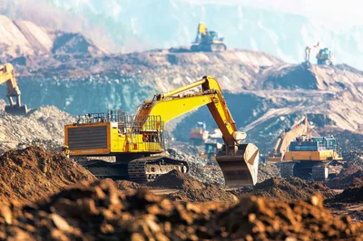 Large Yellow Excavators Working in an Open Pit Mine