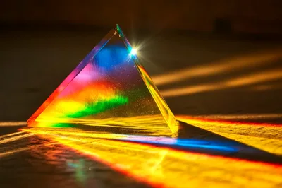 Glass Prism Refracting Light Into A Colorful Spectrum