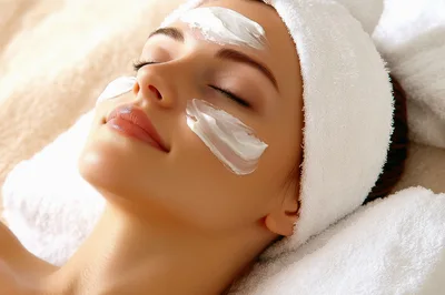 Young Woman Receiving A Relaxing Facial Spa Treatment
