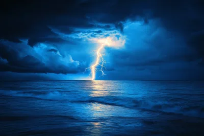 Lightning Bolt Striking The Ocean Surface At Night