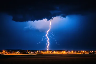 Powerful Lightning Strike Over A Suburban Town At Night