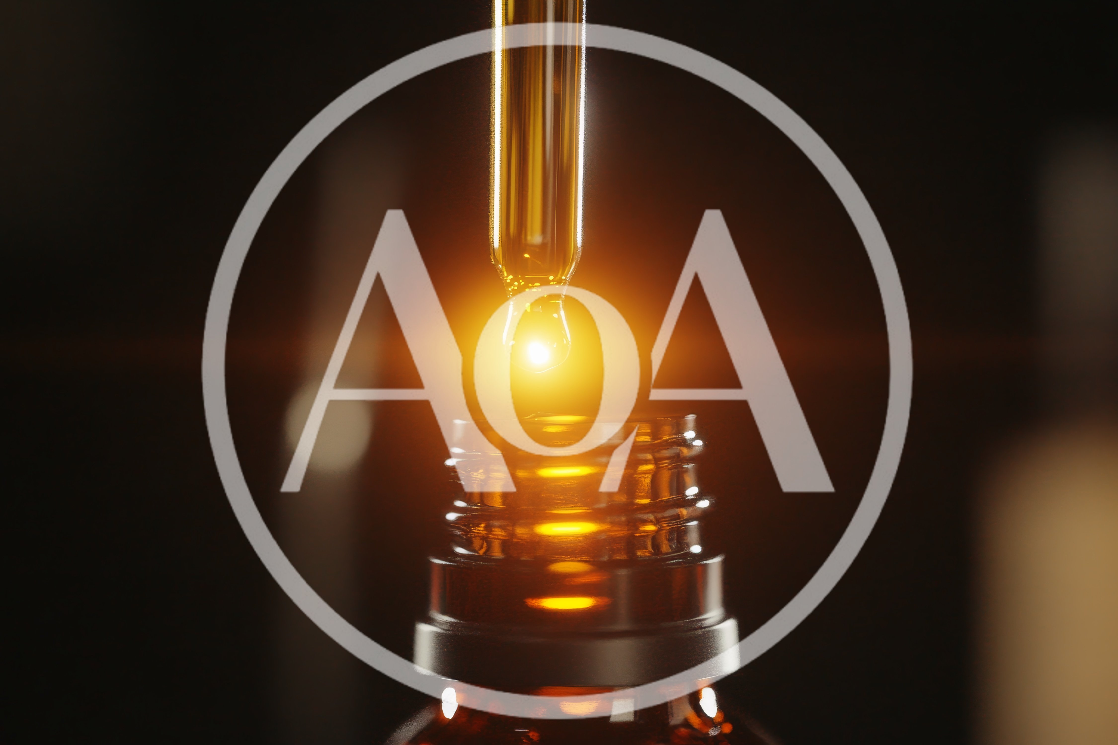 Dropper Dispensing Golden Liquid Into Amber Glass Bottle