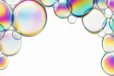 Iridescent Soap Bubbles Floating On White Background
