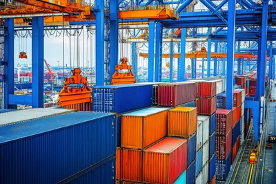 Industrial Shipping Port With Container Cranes And Cargo