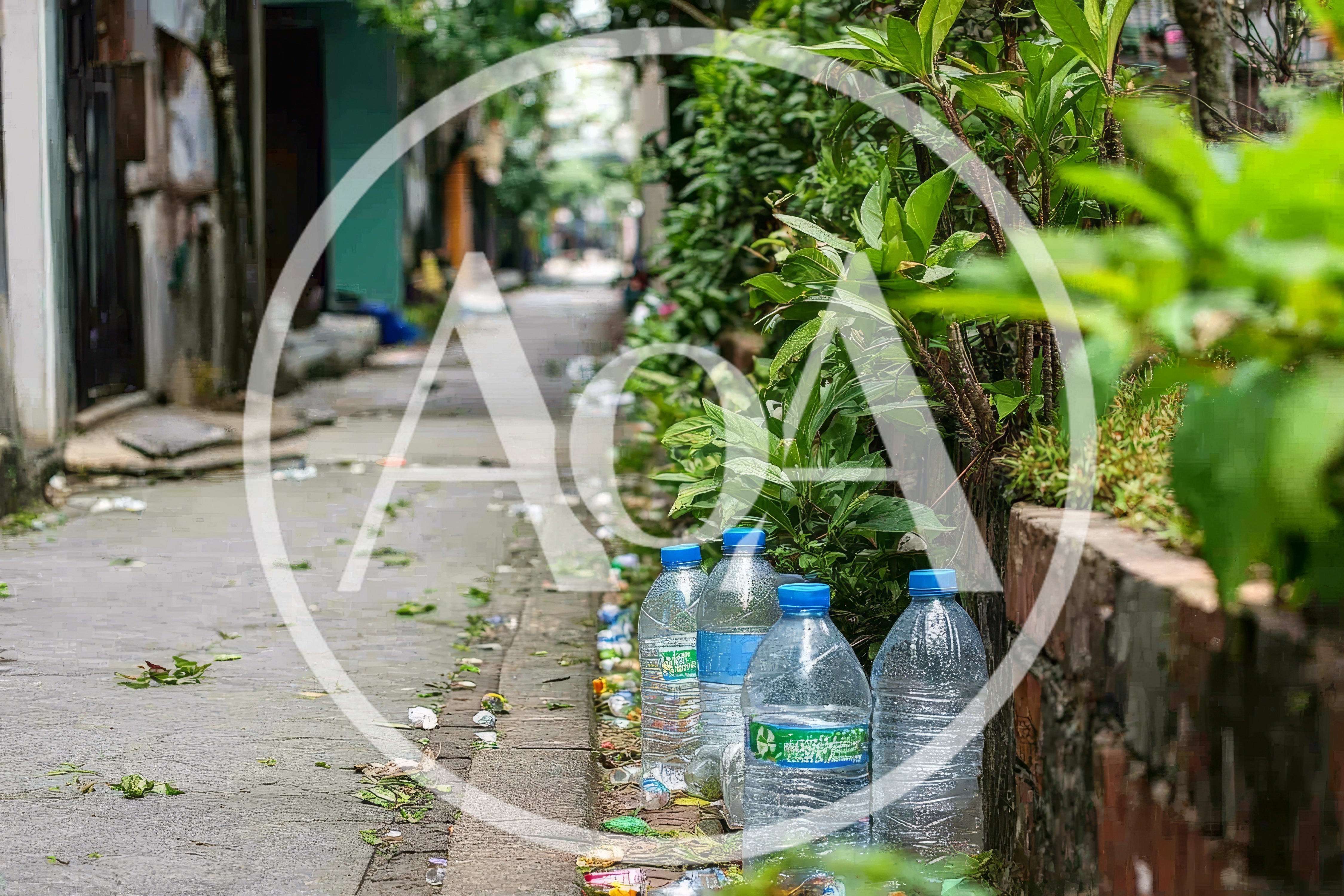 Plastic Water Bottles Discarded Along A Narrow Alleyway
