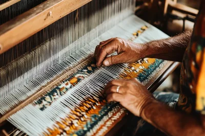 Artisan Weaving Traditional Textile on a Wooden Loom