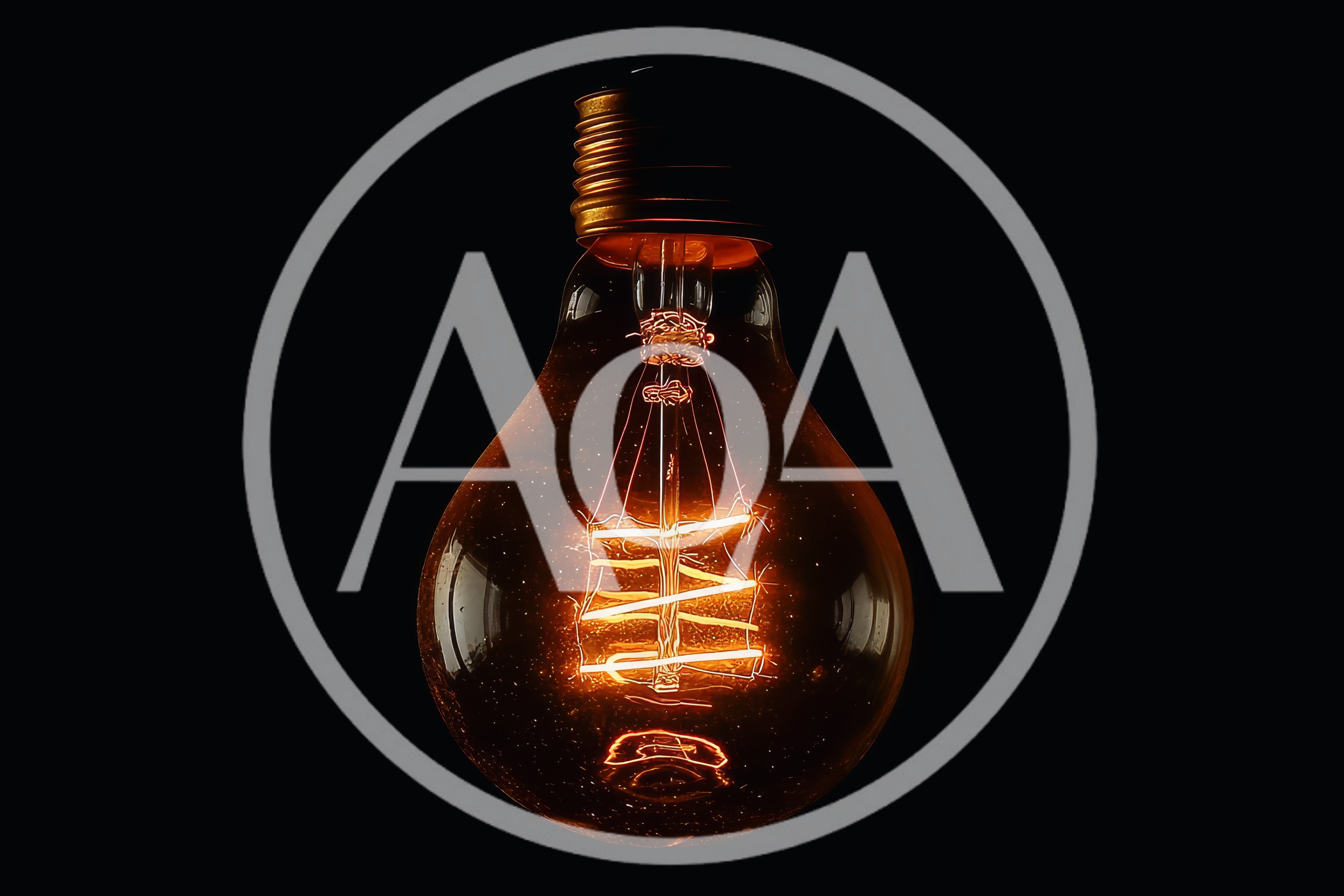 Glowing Vintage Edison Light Bulb Against Black Background