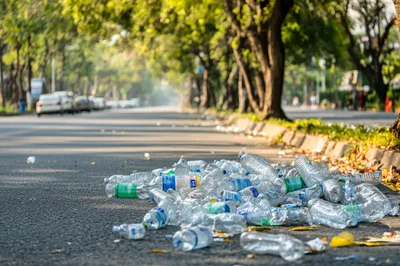 Discarded Plastic Bottles Littering A City Roadside
