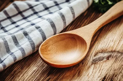 Wooden Spoon Resting On A Rustic Kitchen Table