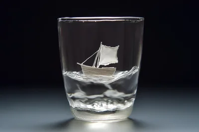 Small Sailboat Figurine Inside A Clear Glass