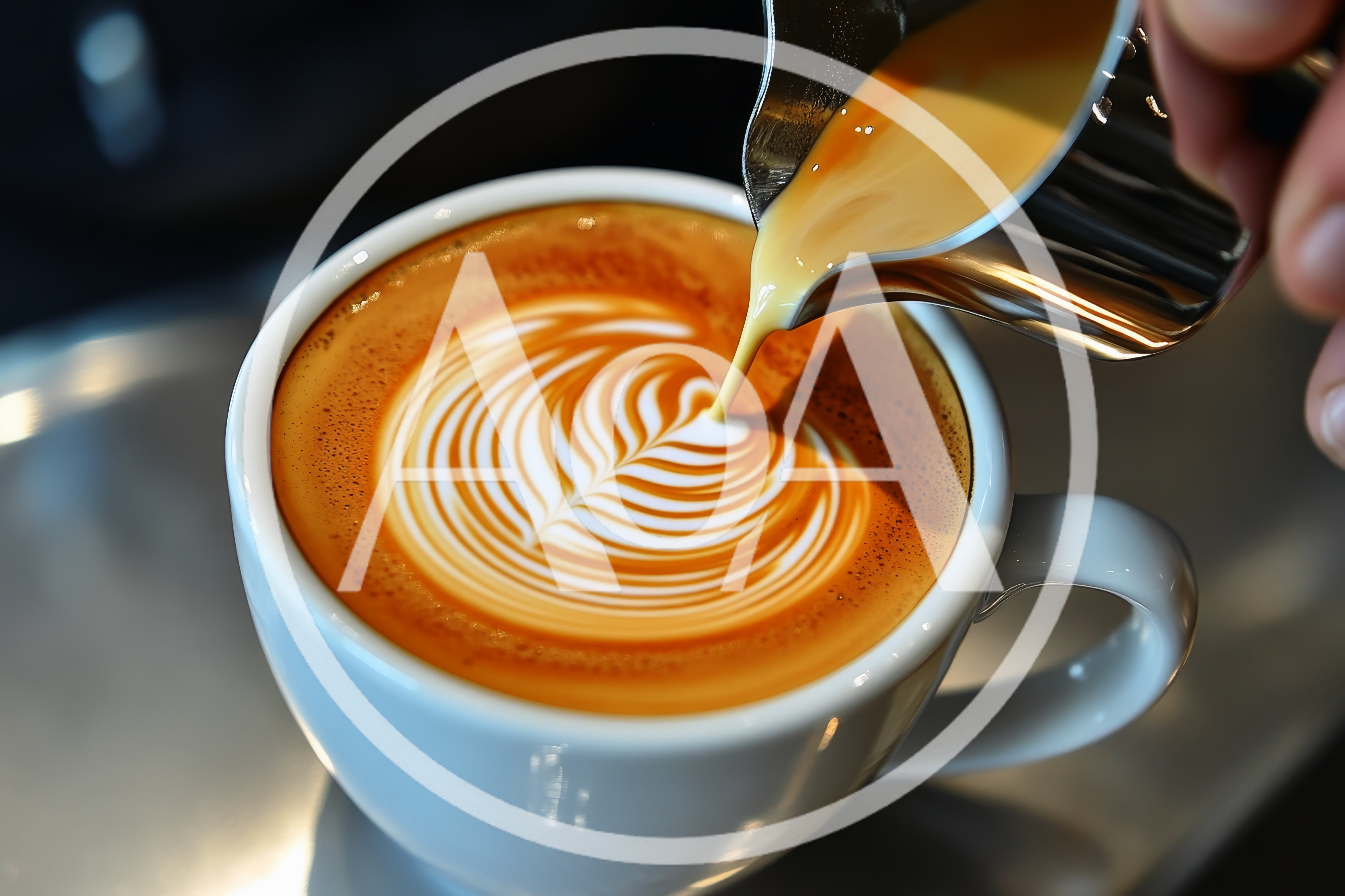 Barista Pouring Steamed Milk Into A Latte