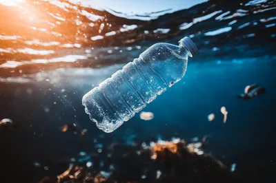 Plastic Water Bottle Floating In Polluted Ocean Water