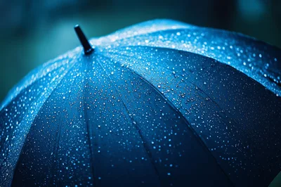 Raindrops On A Dark Blue Umbrella Surface