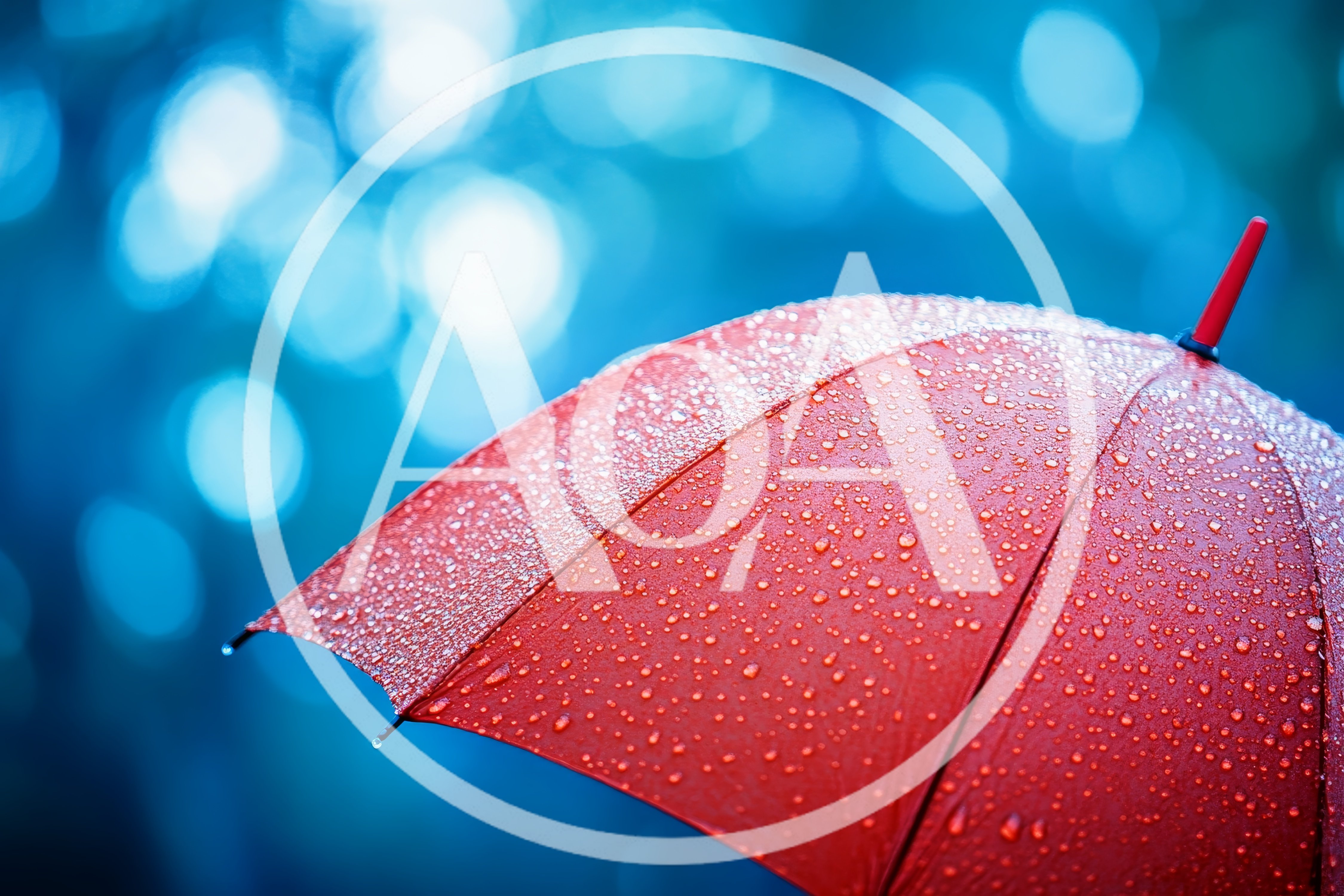 Red Umbrella Covered In Raindrops Against Blue Bokeh Background