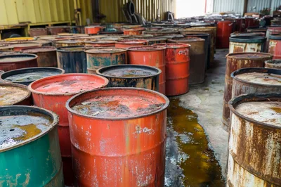 Industrial Storage Facility With Rusted Metal Barrels